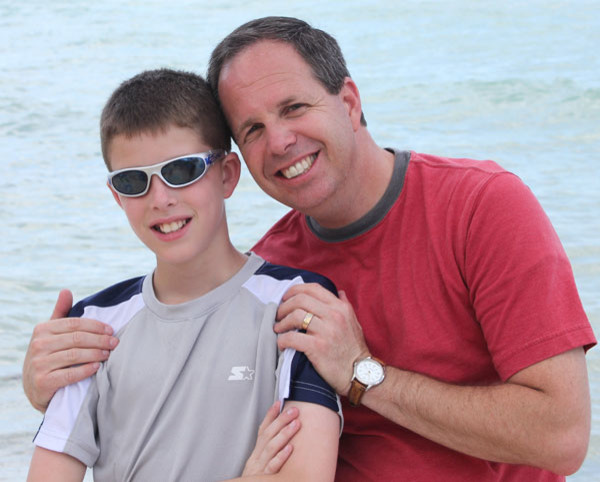 Dad Teen Son Side Hug On Water